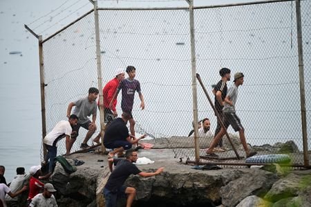 Migrants from Morocco arrive at the Spanish border in Ceuta