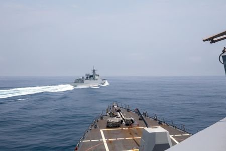FILE PHOTO: Chinese warship sails near U.S. destroyer, in the