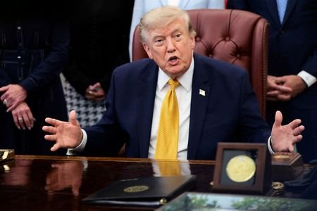 FILE PHOTO: U.S. President Donald Trump signs an executive order