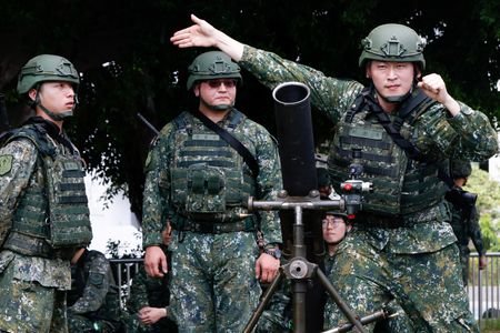 Taiwanese military reservists from a mortar battalion of the Taipei