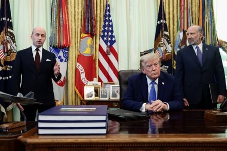 U.S. President Donald Trump signs executive orders at the Oval