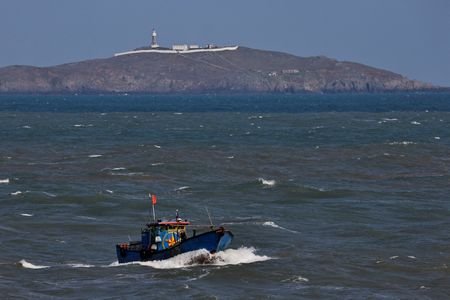 A Chinese fishing boat sails across the Taiwan Strait near