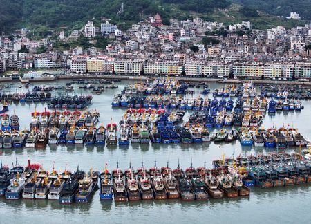 Various vessels are moored at the Huangqi National Central Fishing