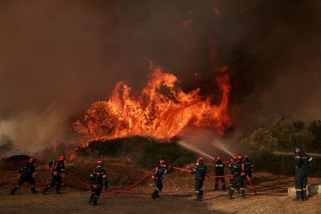 FILE PHOTO: Wildfire burns in Greece