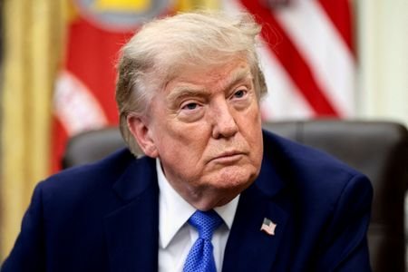 FILE PHOTO: U.S. President Donald Trump signs executive orders at