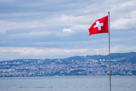 A Swiss flag is pictured in front of the Swiss