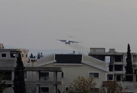 FILE PHOTO: A Russian military aircraft approaches the Hmeimim air