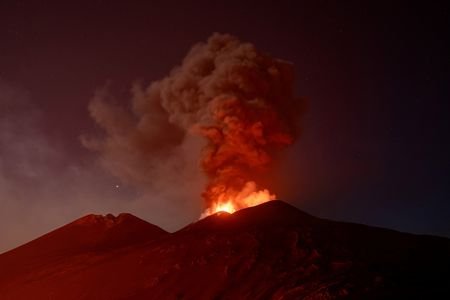 FILE PHOTO: Fiery lava flows illuminate Mount Etna