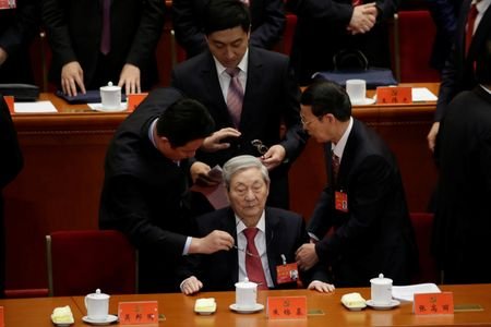 Former Chinese Premier Zhu Rongji (C) leaves after the opening