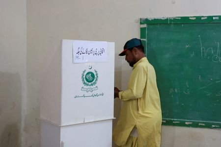A man votes during the second phase of the Azad