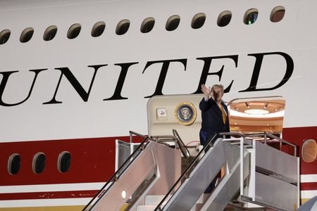 FILE PHOTO: U.S. President Donald Trump boards the new, Qatari-gifted