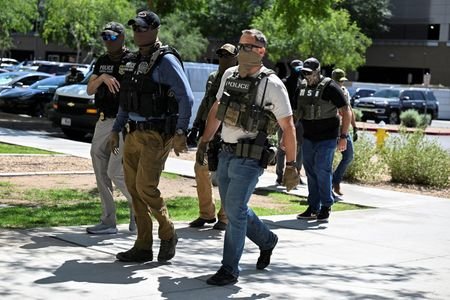 FILE PHOTO: Law enforcement officers, including HSI and ICE agents