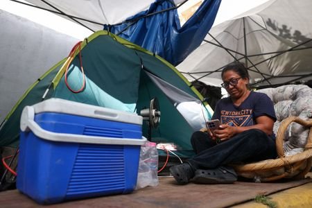 Beaten Venezuelans brace for more severe power, water cuts as
