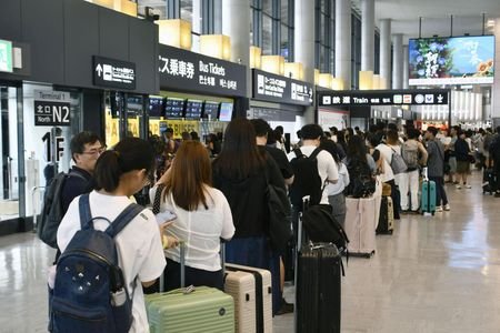 People stranded due to heavy rain crowd Narita International Airport