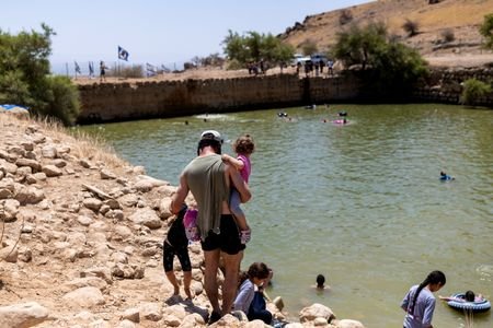 Israelis visit an ancient water reservoir in the Jordan Valley