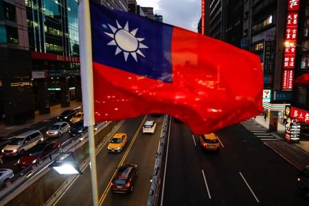 A Taiwan flag can be seen on an overpass ahead