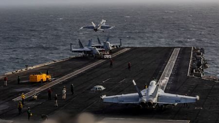 An F/A-18E Super Hornet launches from the flight deck of