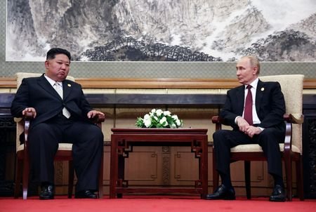 FILE PHOTO: Russian President Vladimir Putin and North Korean leader