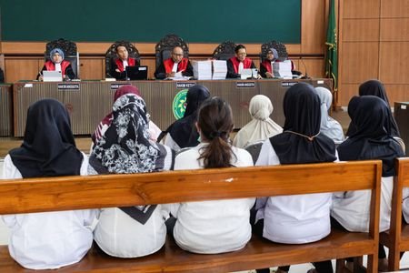 Sunaryanto, the chief judge reads the charges for daycare staffers
