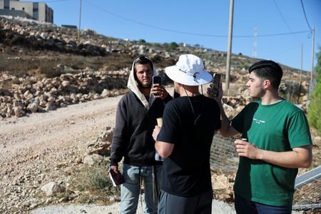 Palestinian-American Loui Ridi and his nephew Ahmed (R), whose house