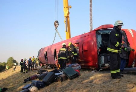 Firefighters work at the scene of a deadly accident near