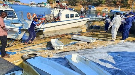 Rescue personnel work during an operation to recover victims from