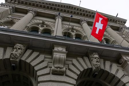 A Swiss flag hangs at the Swiss Parliament building (Bundeshaus)