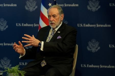 U.S. Ambassador to Israel Mike Huckabee looks on during an