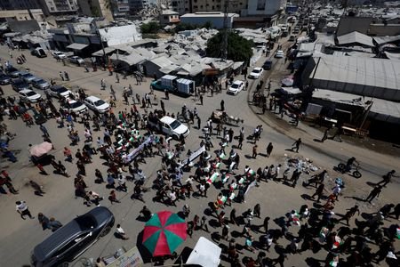 Funeral of 50 people from three families killed during the