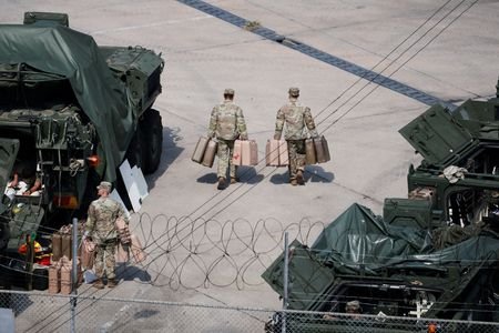 FILE PHOTO: South Korea's Lee backs stronger self-defense, says drills