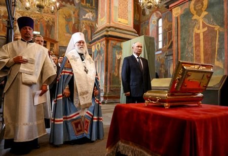 Russian President Vladimir Putin visits the Archangel Cathedral of the