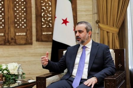 Syrian Foreign Minister Asaad al-Shaibani, speaks during an interview with