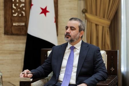 Syrian Foreign Minister Asaad al-Shaibani, looks on during an interview