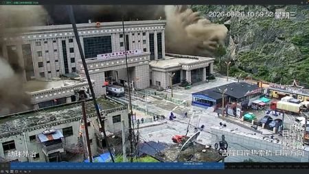 A CCTV footage shows people running away as wall of