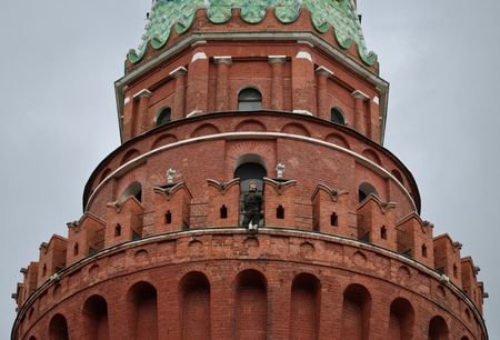 A security guard watches from the Kremlin's tower in Moscow