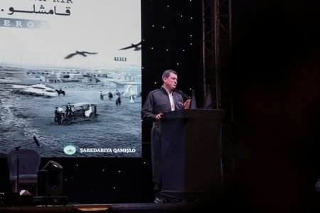 SDF commander Mazloum Abdi delivers a speech during a celebration