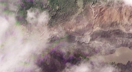 A satellite image shows a barrier lake at the border