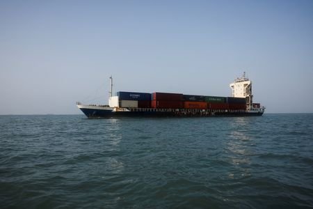 A vessel in the Strait of Hormuz visible near the