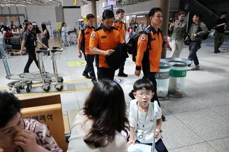 Members of a government response team that includes officials from