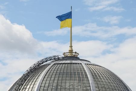 Ukrainian flag over parliament building in Kyiv