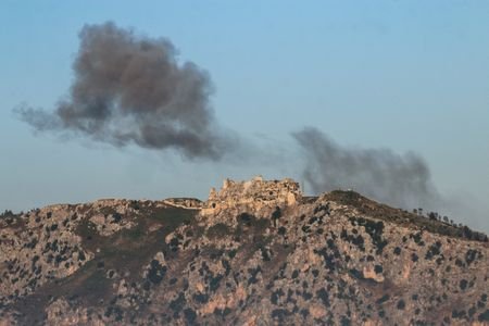 Smoke rises near Beaufort Castle which was captured by Israeli