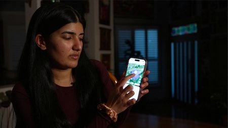Australian medical student, Sarada Viswanathan, looks at a screenshot of