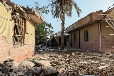 Rubble lies around damaged houses following a reported attack near