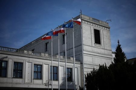 Polish and European Union flags are seen in front of