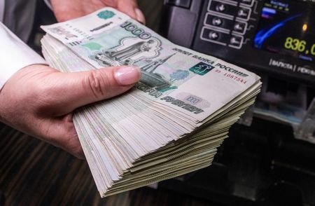 Illustration shows Russian rouble banknotes
