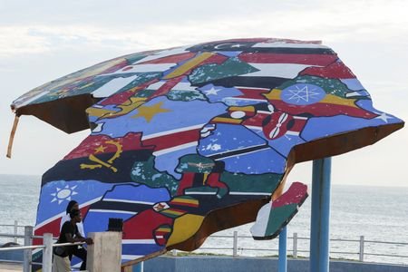 A sculpture of the African continent, painted with the flags