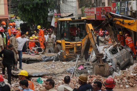 Search for survivors following building collapse in New Delhi