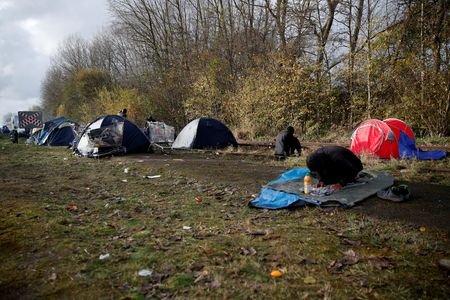 FILE PHOTO: Makeshift migrant camp of Loon Beach in Dunkerque