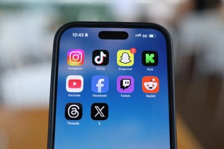 Social media apps are displayed on a mobile phone
