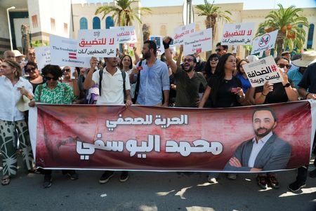 Tunisian journalists participate in a rally called by the Tunisia